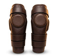 Pair of brown genuine leather polo knee guards with foam padded disc by Best Horse