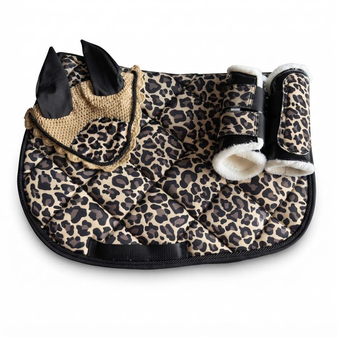 Tan leopard print saddle pad set with black crochet fly veil and leopard brushing boots by Best Horse