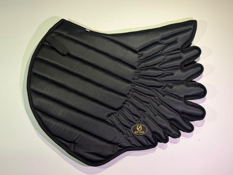 Black satin wing saddle pad with quilted channels and Best Horse badge