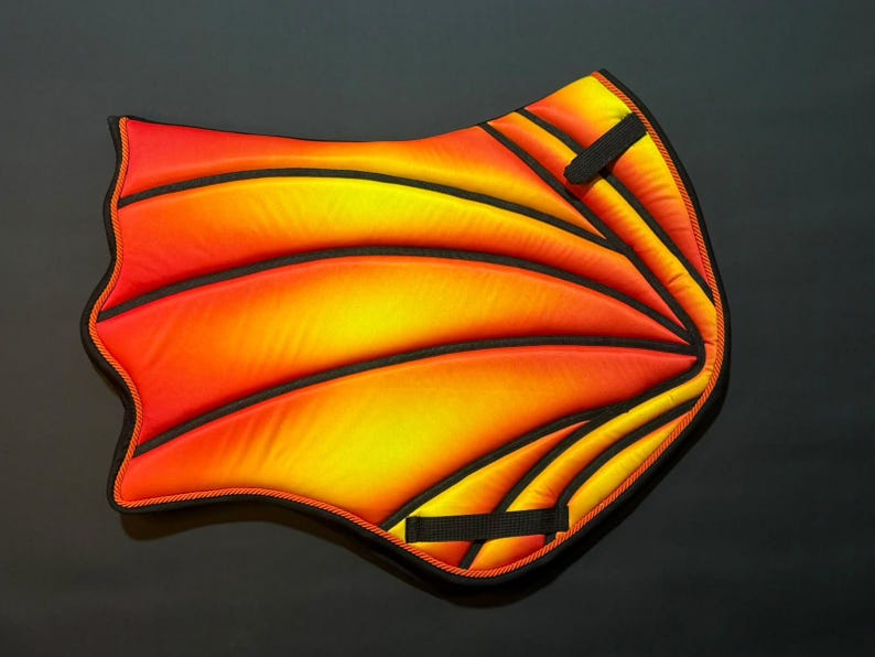 Red orange and yellow fire gradient saddle pad with black piped wing panels